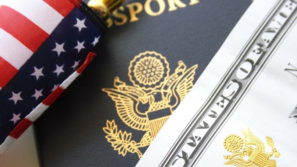 A close shot of the U.S. flag and passport.
