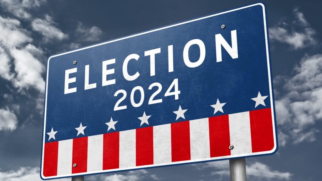 A red, white and blue sign that reads "Election 2024"